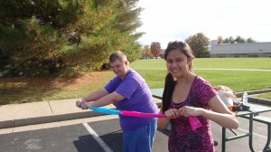 Monica and Brandy demonstrating resistance band exercises.