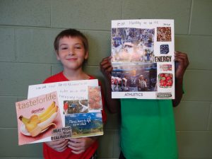 Two boys holding magazine cut out collages with health messages