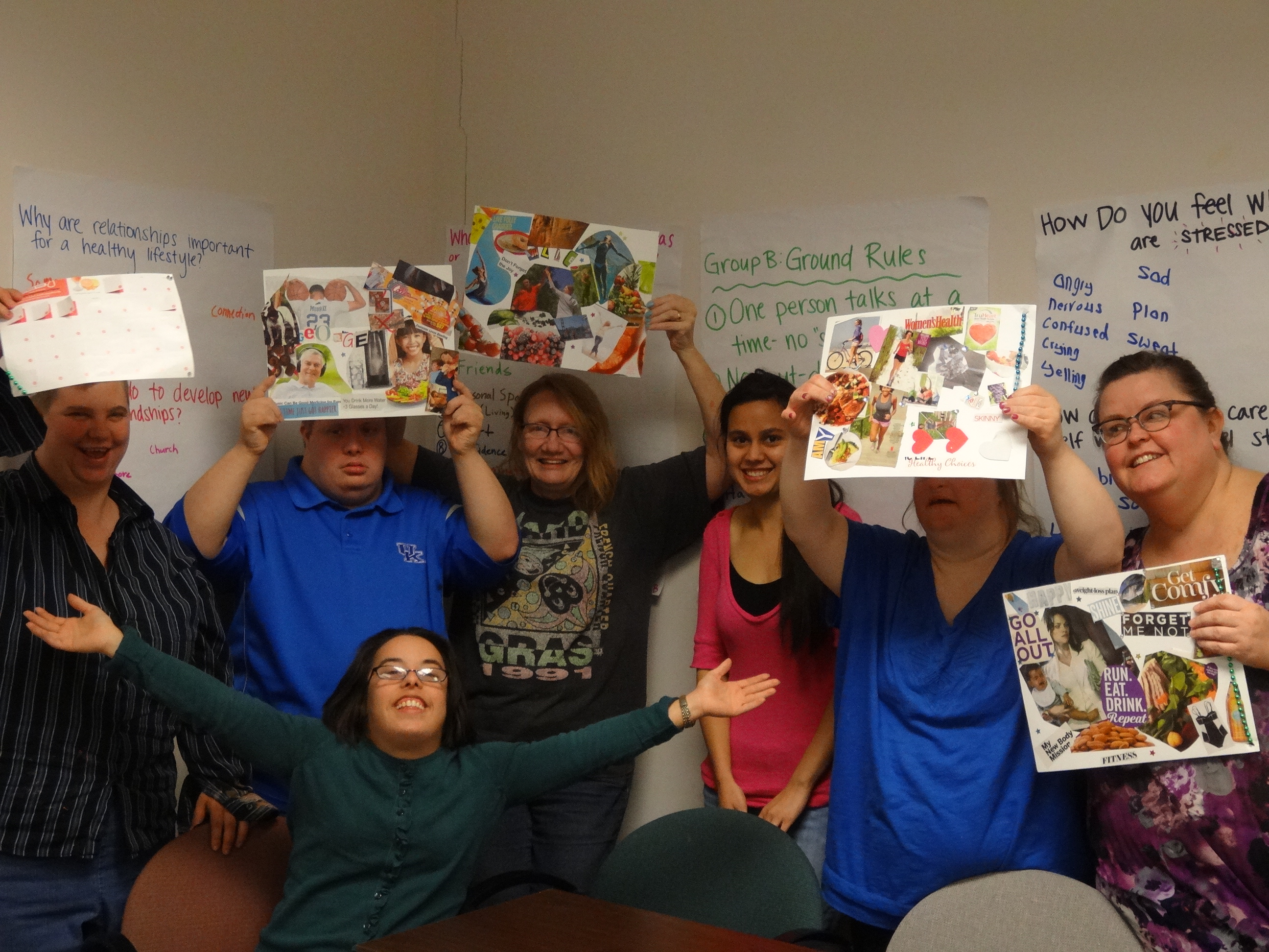 megan mccormick with students holding their collages