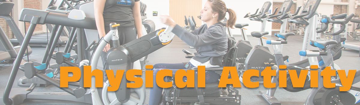 Photo of a girl who uses a wheelchair participating in physical activity at a gym.